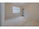Neutral guest bedroom with bright, natural light, carpeted floors and simple decor at 9032 Retro Ct, Las Vegas, NV 89149
