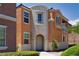 Attractive two-story home with a neutral color scheme, arched entryway, and desert landscaping at 9032 Retro Ct, Las Vegas, NV 89149