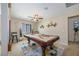 Game room with a pool table, ceiling fan, and window for natural light at 9032 Retro Ct, Las Vegas, NV 89149