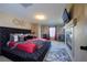 Main bedroom boasts a fireplace, TV, plush bed, and neutral colors at 9032 Retro Ct, Las Vegas, NV 89149