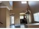 Open concept living room features high ceilings and an open view to the kitchen at 9145 Sunken Meadow Ave, Las Vegas, NV 89178