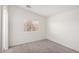Spacious bedroom featuring neutral carpet, bright white walls and a sun-filled window at 9333 Leaping Deer Pl # 102, Las Vegas, NV 89178