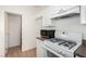 Clean kitchen with ample storage, microwave, and stove at 9333 Leaping Deer Pl # 102, Las Vegas, NV 89178