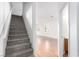 View of the home's entry stairs, front living room and doorway leading to a bathroom at 9333 Leaping Deer Pl # 102, Las Vegas, NV 89178