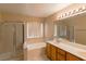 Bathroom with separate shower and tub, double sinks, and lots of lighting at 9849 Ridge Hill Ave, Las Vegas, NV 89147
