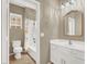 Compact bathroom featuring a shower-tub combo and vanity with storage at 9869 Lime Tree St, Las Vegas, NV 89178