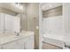 Bright bathroom with a shower-tub combo and white vanity at 9869 Lime Tree St, Las Vegas, NV 89178