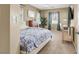 Primary bedroom with calming colors, two windows and desk setup at 9869 Lime Tree St, Las Vegas, NV 89178