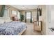 Comfortable bedroom featuring a ceiling fan, mounted TV, and a sunlit window at 9869 Lime Tree St, Las Vegas, NV 89178