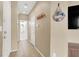 Cozy hallway featuring neutral paint, leading to a bathroom and other rooms in the home at 9869 Lime Tree St, Las Vegas, NV 89178