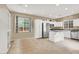 Bright kitchen with white cabinetry, stainless steel appliances, and an open layout at 9869 Lime Tree St, Las Vegas, NV 89178