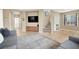 Comfortable living room featuring tile flooring, a TV, and a staircase leading to the upper level at 9869 Lime Tree St, Las Vegas, NV 89178