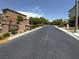 Street view of the neighborhood entrance featuring manicured landscaping and signage at 9869 Lime Tree St, Las Vegas, NV 89178