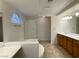 Bathroom with a tub, shower, and double vanity sink at 10052 Baystone St, Las Vegas, NV 89141