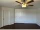 Bedroom featuring dark floors, neutral paint, and a double-door closet at 10052 Baystone St, Las Vegas, NV 89141