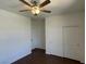 Bedroom featuring wood-look floors, fan, and closet space, offering comfort and convenience at 10052 Baystone St, Las Vegas, NV 89141