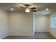 Bright bedroom with a ceiling fan, neutral paint, carpet, and natural light at 10052 Baystone St, Las Vegas, NV 89141