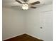Simple bedroom with wood floors, ceiling fan and standard closet door at 10052 Baystone St, Las Vegas, NV 89141