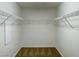 Walk-in closet features wire shelving and neutral carpeting, providing ample storage space at 10052 Baystone St, Las Vegas, NV 89141