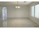 Bright dining area featuring stylish chandelier lighting, and marble flooring at 10052 Baystone St, Las Vegas, NV 89141