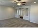 Living room showing carpet, neutral paint, and an entryway with decorative pillars at 10052 Baystone St, Las Vegas, NV 89141