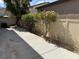 Well-maintained backyard with concrete patio and vibrant landscaping creating a serene outdoor oasis at 10118 Farmington Hall Ct, Las Vegas, NV 89129
