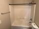 Bathroom featuring a tub-shower combination, a shower head, and a towel rack at 10118 Farmington Hall Ct, Las Vegas, NV 89129