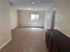 Upstairs bonus room with neutral carpeting and a storage cabinet at 10118 Farmington Hall Ct, Las Vegas, NV 89129