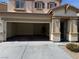 Spacious two-car garage with an automatic door and ample room for parking and storage at 10118 Farmington Hall Ct, Las Vegas, NV 89129