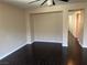 Living room with hardwood floors, neutral walls and open floor plan at 10118 Farmington Hall Ct, Las Vegas, NV 89129