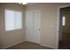 Bedroom featuring carpeted floors, a window, and a closet with sliding doors at 10321 Birch Bluff Ln, Las Vegas, NV 89145