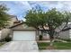 Charming single-story home with a well-maintained lawn, mature tree, and two-car garage at 10321 Birch Bluff Ln, Las Vegas, NV 89145