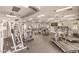 Spacious fitness center with modern exercise equipment, mirrored walls, and ceiling fans at 10321 Birch Bluff Ln, Las Vegas, NV 89145