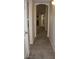 Hallway view with archway and access to multiple rooms in the home at 10321 Birch Bluff Ln, Las Vegas, NV 89145