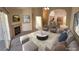 Bright living room featuring a cozy fireplace, plush seating, and open access to the kitchen at 10321 Birch Bluff Ln, Las Vegas, NV 89145