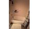 This is a bathtub and shower combination with shampoo and soap bottles on the ledge at 105 Huntly Rd, Las Vegas, NV 89145