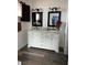 Bathroom vanity with double sinks, white cabinetry, and granite countertop at 105 Huntly Rd, Las Vegas, NV 89145