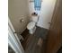 Small bathroom with a toilet and wood-look flooring at 105 Huntly Rd, Las Vegas, NV 89145