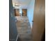 Spacious bedroom featuring wood-look floors, ceiling fan and two closets providing ample storage space at 105 Huntly Rd, Las Vegas, NV 89145