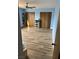 Large bedroom with wood-look flooring and double closets at 105 Huntly Rd, Las Vegas, NV 89145