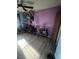 Bedroom featuring wood-look flooring and bikes stored on the wall and floor at 105 Huntly Rd, Las Vegas, NV 89145