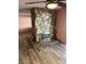 Stone fireplace with wood-look flooring and ceiling fan above at 105 Huntly Rd, Las Vegas, NV 89145