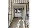 Covered front entryway with security gate and double doors at 105 Huntly Rd, Las Vegas, NV 89145