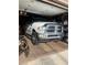An organized garage with a truck parked on an epoxy floor at 105 Huntly Rd, Las Vegas, NV 89145