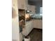 Kitchen featuring light wooden floors, white cabinets, and a range at 105 Huntly Rd, Las Vegas, NV 89145