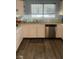 Kitchen featuring light wooden floors, white cabinets, and a stainless-steel dishwasher at 105 Huntly Rd, Las Vegas, NV 89145