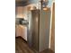 Well-lit kitchen featuring a stainless steel refrigerator and ample counter space at 105 Huntly Rd, Las Vegas, NV 89145