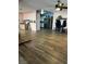 Open living area with wood-look floors connecting to kitchen at 105 Huntly Rd, Las Vegas, NV 89145