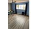 Spacious living room featuring laminate flooring and a bright window at 105 Huntly Rd, Las Vegas, NV 89145
