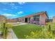 Inviting backyard featuring a pool, spa, artificial grass, and desert landscaping at 1120 Via Della Curia, Henderson, NV 89011